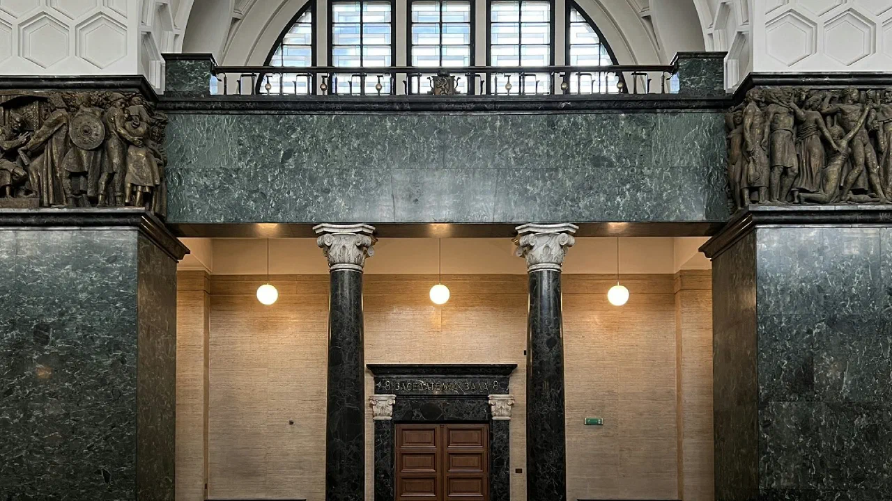 the columned stone interior of a courthouse building
